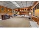 Finished basement with a wood-burning fireplace, and game room with ping pong table at 4383 Pool Rd, Winston, GA 30187
