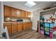 Basement storage area featuring wall-to-wall shelving, wood floors, and a ceiling light at 4383 Pool Rd, Winston, GA 30187