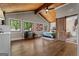 Spacious bedroom boasts a vaulted wood ceiling, multiple windows, and a vanity at 4383 Pool Rd, Winston, GA 30187