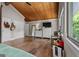 Spacious bedroom features a wooden ceiling, hardwood floors, and multiple windows at 4383 Pool Rd, Winston, GA 30187