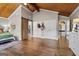 Spacious bedroom featuring a wooden ceiling, hardwood floors, and a barn door at 4383 Pool Rd, Winston, GA 30187