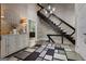 Bright foyer with decorative rug, staircase, and light fixture at 4383 Pool Rd, Winston, GA 30187