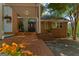 Welcoming front entrance with a covered porch and beautiful landscaping at 4383 Pool Rd, Winston, GA 30187
