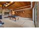 Spacious game room featuring stone fireplace and wood paneled accent wall with Auburn decoration over the pool table at 4383 Pool Rd, Winston, GA 30187