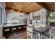 Open kitchen layout with dining area featuring ample cabinet space and modern finishes at 4383 Pool Rd, Winston, GA 30187