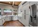 Bright kitchen features stainless appliances, granite countertops, and white cabinetry at 4383 Pool Rd, Winston, GA 30187