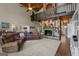 Spacious living room features a stone fireplace, wood ceiling with fan, and a comfortable sectional sofa at 4383 Pool Rd, Winston, GA 30187