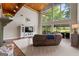 Comfortable living room featuring high ceilings, a fireplace, and large windows at 4383 Pool Rd, Winston, GA 30187