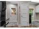 Bright mudroom features a laundry station, storage bench, and access to the backyard at 4383 Pool Rd, Winston, GA 30187