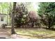 Spacious backyard with mature trees, lush greenery, and natural beauty at 206 Pine Cedar Cir, Brooks, GA 30205