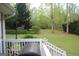 View of the backyard with green grass and a patio at 206 Pine Cedar Cir, Brooks, GA 30205