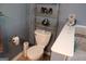 Bathroom features a toilet, a shelf, and decorative accessories at 206 Pine Cedar Cir, Brooks, GA 30205