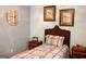 Cozy bedroom with coordinating bedside tables, stylish wall decor and comfortable twin bed at 206 Pine Cedar Cir, Brooks, GA 30205