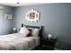 Charming bedroom features a black bed frame, a quilt, and side tables at 206 Pine Cedar Cir, Brooks, GA 30205