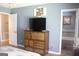 Bedroom featuring a chest of drawers and an open doorway to the bathroom at 206 Pine Cedar Cir, Brooks, GA 30205