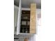 Kitchen cabinet featuring stacked shelving for spices, canned goods, and other kitchen essentials at 206 Pine Cedar Cir, Brooks, GA 30205