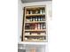 Kitchen cabinet offering ample spice storage on multiple wooden shelves at 206 Pine Cedar Cir, Brooks, GA 30205