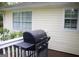 View of the deck with a grill and white siding at 206 Pine Cedar Cir, Brooks, GA 30205