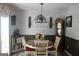 Inviting dining room with a round table, hardwood floors, and decorative lighting at 206 Pine Cedar Cir, Brooks, GA 30205