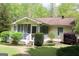 Exterior of home showing screened porch, landscaping, and a brick pathway at 206 Pine Cedar Cir, Brooks, GA 30205