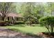 Charming single-story home with a well-manicured lawn and landscaping at 206 Pine Cedar Cir, Brooks, GA 30205