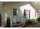 Exterior view of home with siding and dark red shutters, highlighting the front entrance at 206 Pine Cedar Cir, Brooks, GA 30205