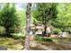 Picturesque home exterior with a welcoming porch and natural surroundings at 206 Pine Cedar Cir, Brooks, GA 30205