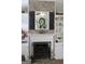 Close-up of the fireplace with decorative mantel, built-in shelving, and neutral color palette at 206 Pine Cedar Cir, Brooks, GA 30205