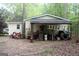 Detached garage with open storage, tools, and a lawn mower at 206 Pine Cedar Cir, Brooks, GA 30205