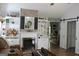 Spacious living room with a fireplace, built-in shelving, and a view into the dining area and kitchen at 206 Pine Cedar Cir, Brooks, GA 30205