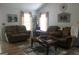 Cozy living room featuring hardwood floors, comfortable seating, and plenty of natural light at 206 Pine Cedar Cir, Brooks, GA 30205