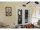 Enclosed porch with decorations and glass doors leading to the home's interior at 206 Pine Cedar Cir, Brooks, GA 30205