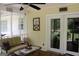 Relaxing screened in porch with comfortable seating and view of back yard at 206 Pine Cedar Cir, Brooks, GA 30205