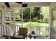 Inviting screened-in porch with views of a lush, well-maintained yard at 206 Pine Cedar Cir, Brooks, GA 30205