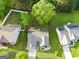 A beautiful aerial view of a well-maintained property showcasing lush greenery and a charming home at 327 Viceroy Curv, Stockbridge, GA 30281