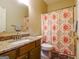 Bathroom with a single vanity, and shower with patterned curtain at 327 Viceroy Curv, Stockbridge, GA 30281