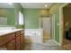 Bathroom featuring double vanity, tub, and walk-in shower at 327 Viceroy Curv, Stockbridge, GA 30281