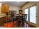 Cozy breakfast area adjacent to the kitchen with a table and chairs next to doors to the outside at 327 Viceroy Curv, Stockbridge, GA 30281