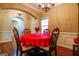 Warm dining area featuring wood floors, decorative chairs, and bright natural light at 327 Viceroy Curv, Stockbridge, GA 30281