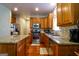 Modern kitchen featuring stainless steel appliances, granite countertops, and ample cabinet space at 327 Viceroy Curv, Stockbridge, GA 30281