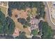 Aerial view of property at 5380 Somerlane Trail SW, Atlanta, Georgia, surrounded by lush trees and foliage at 5380 Somerlane Trl, Atlanta, GA 30349