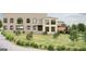 Beautiful two-story home with a manicured lawn, complemented by lovely trees and lush landscaping elements at 5380 Somerlane Trl, Atlanta, GA 30349