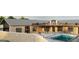 Exterior shot of gorgeous home featuring a refreshing in-ground swimming pool and a private courtyard area at 5380 Somerlane Trl, Atlanta, GA 30349