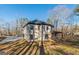Modern two-story home featuring black trim windows and a covered porch with natural wood columns at 421 Saint Surrey Way, Ellenwood, GA 30294