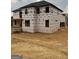 New construction home with black trim windows and a large wooden deck ready for the next phase at 421 Saint Surrey Way, Ellenwood, GA 30294