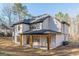 Spacious backyard of home featuring covered patio and large windows at 421 Saint Surrey Way, Ellenwood, GA 30294
