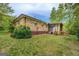Brick home's backyard features a screened porch and grassy lawn at 6950 Shannon Dr, Lithia Springs, GA 30122