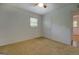 Bedroom featuring carpet, a ceiling fan and a door to an adjacent room at 6950 Shannon Dr, Lithia Springs, GA 30122