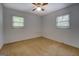 Bedroom with carpet, natural light from two windows, and ceiling fan at 6950 Shannon Dr, Lithia Springs, GA 30122