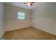 Bedroom with neutral walls and carpet, with a window at 6950 Shannon Dr, Lithia Springs, GA 30122